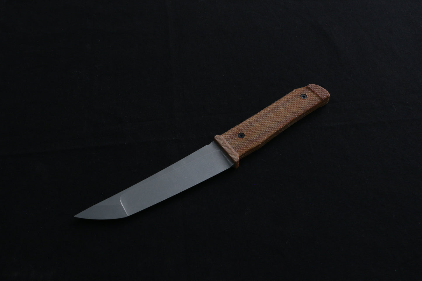 Knife with a wooden handle on a black background