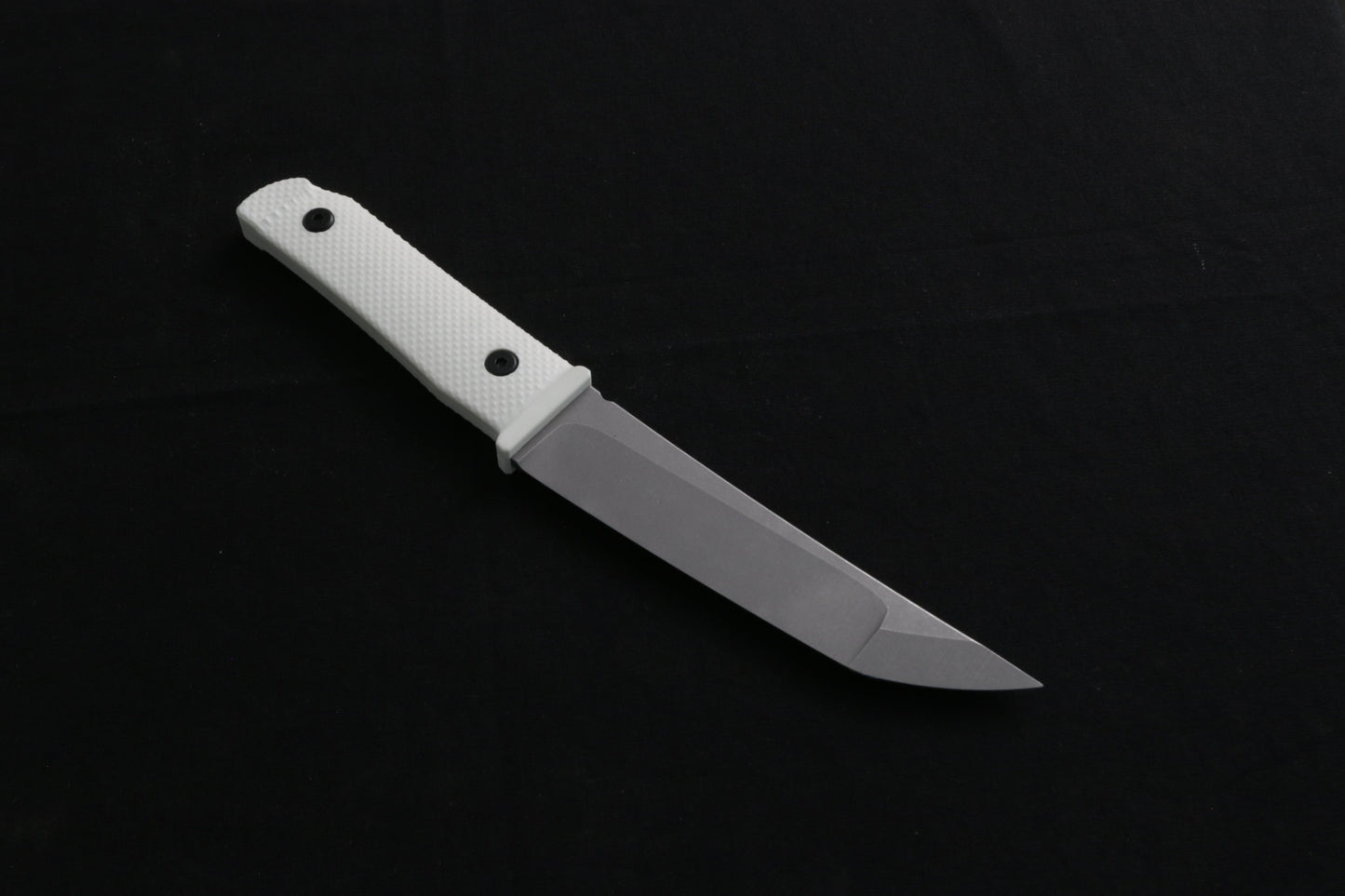 Knife with a white handle on a black background