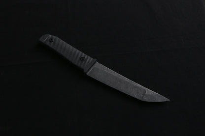 Knife on a dark surface with a blurred background