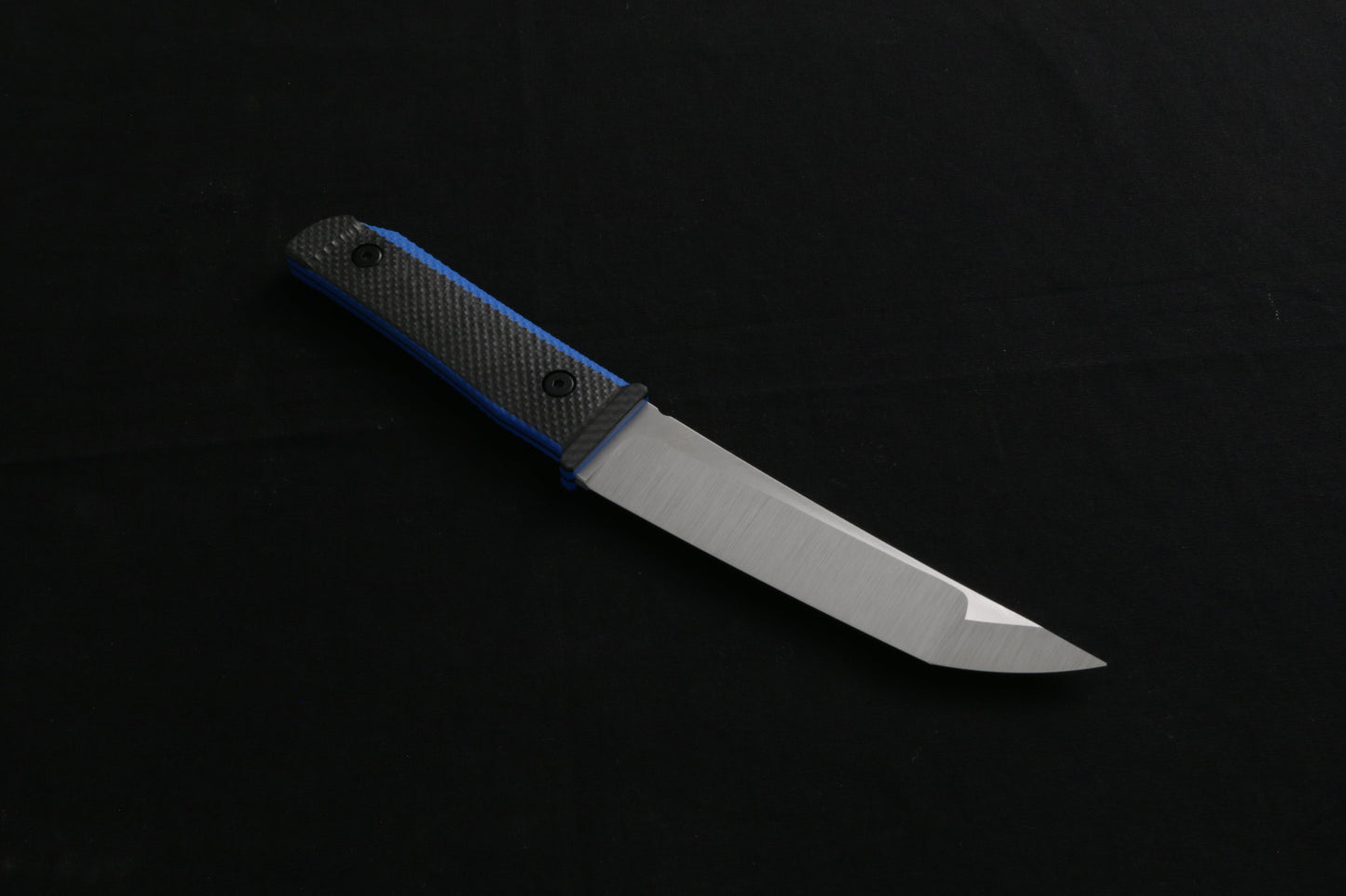 Carbon fiber knife on a black background