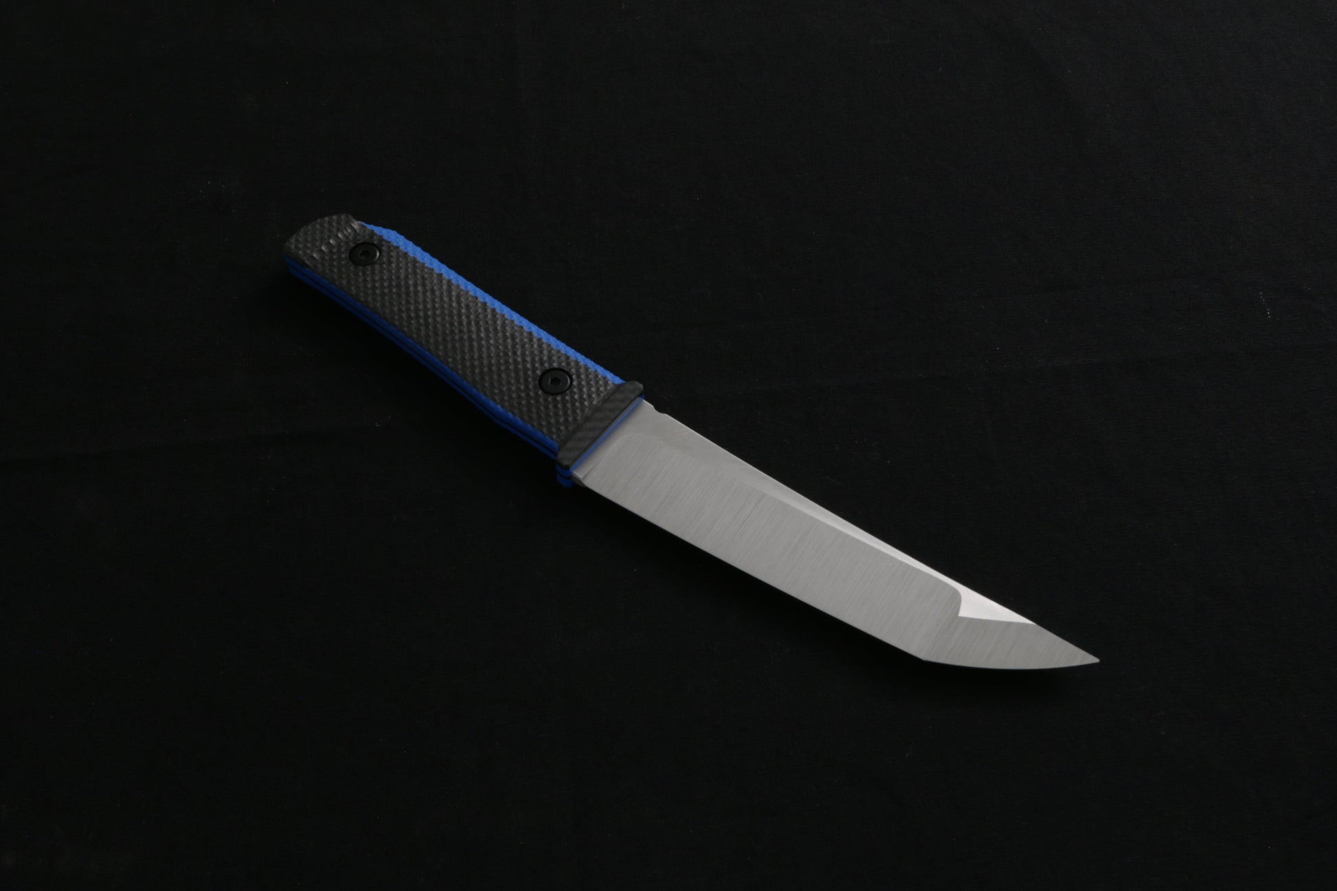 Carbon fiber knife on a black background