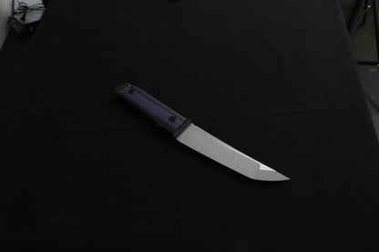 Knife with a black handle on a dark background