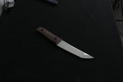 Knife with a brown handle on a black background