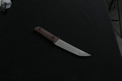 Knife with a wooden handle on a dark background